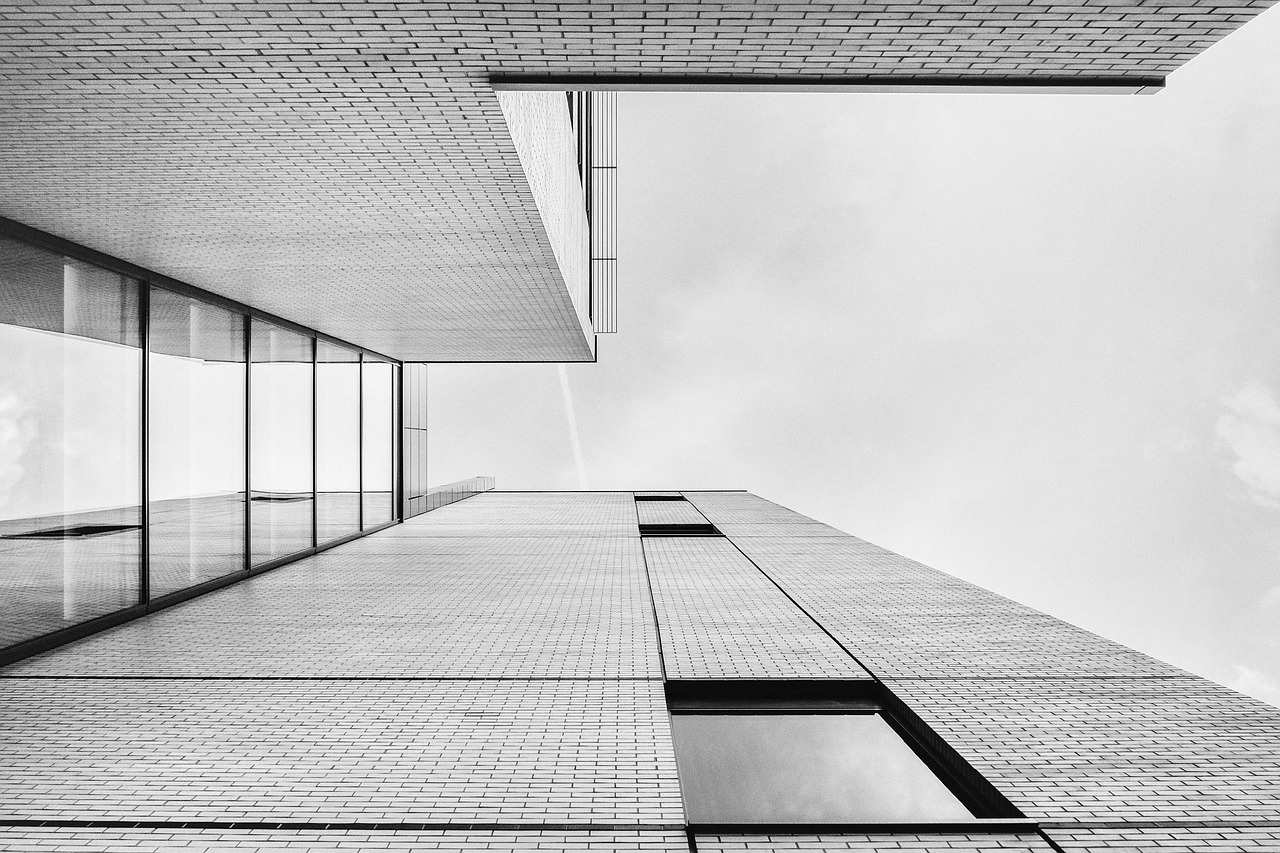 A courtyard building photographed straight up in black and white