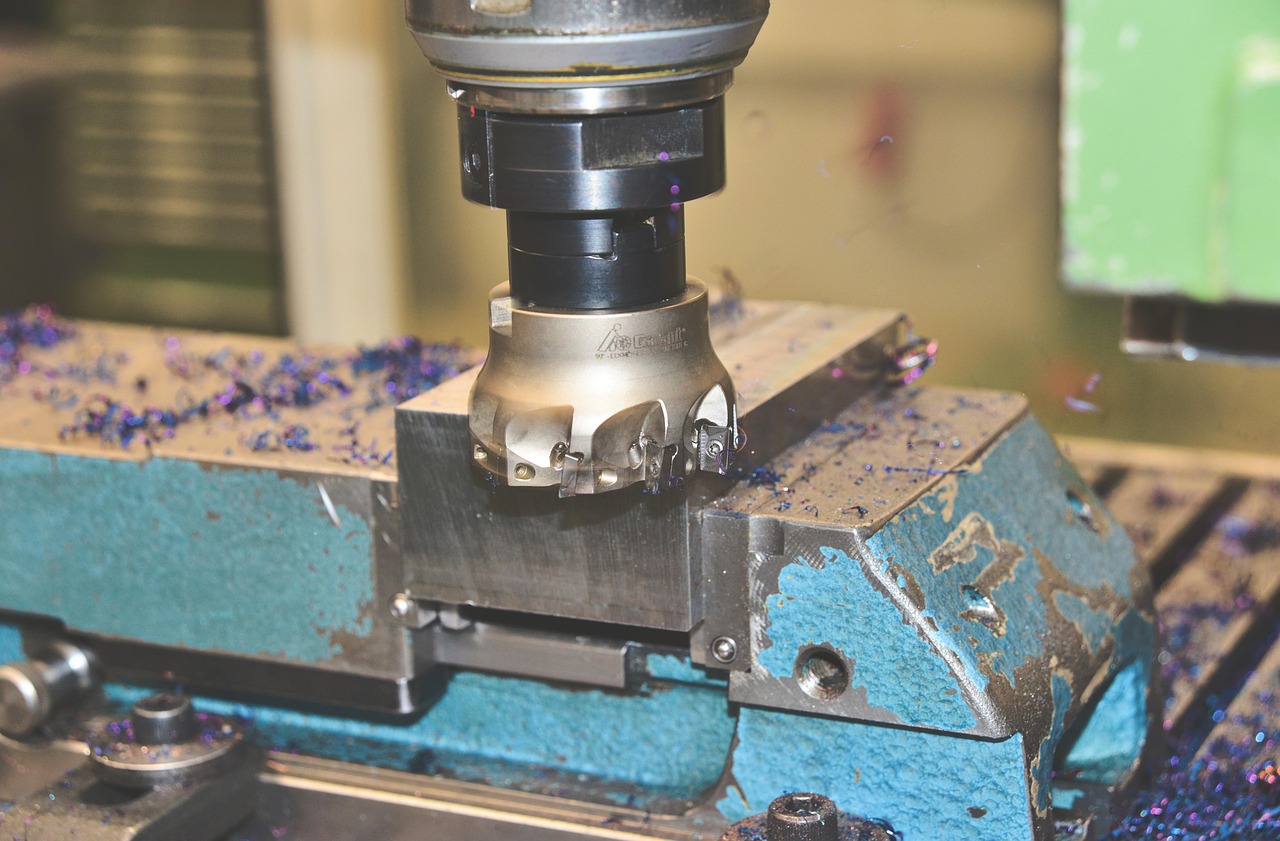 A milling cutter mid-cut with metal chips
